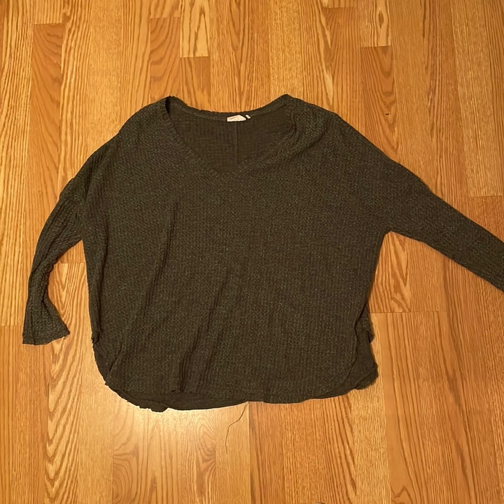 Out from under grey sweater